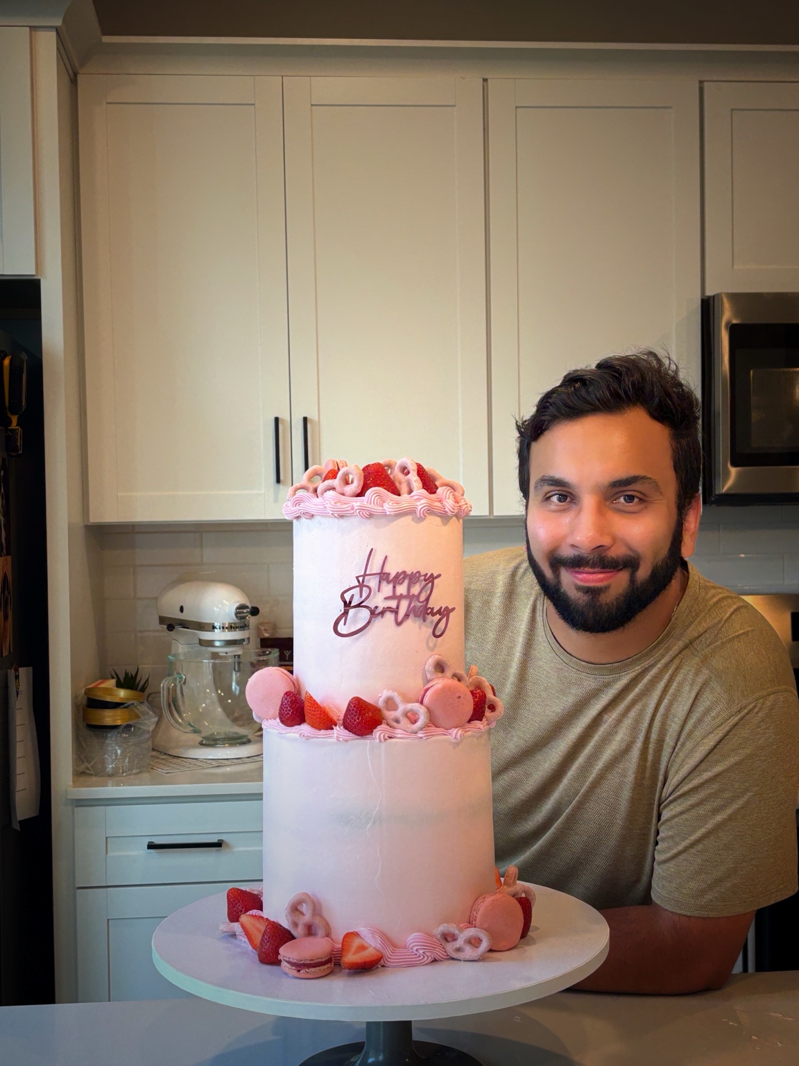 Antonio presenting a two-tier custom cake