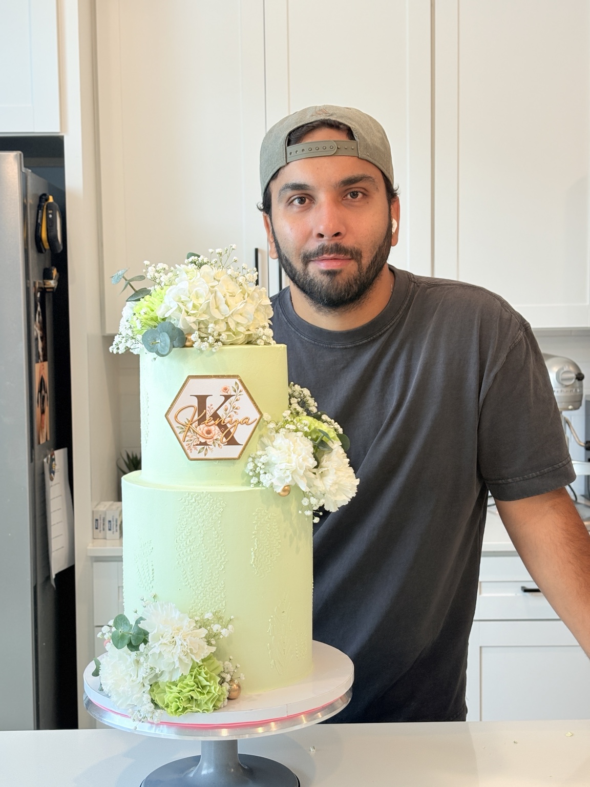Antonio with a custom floral cake